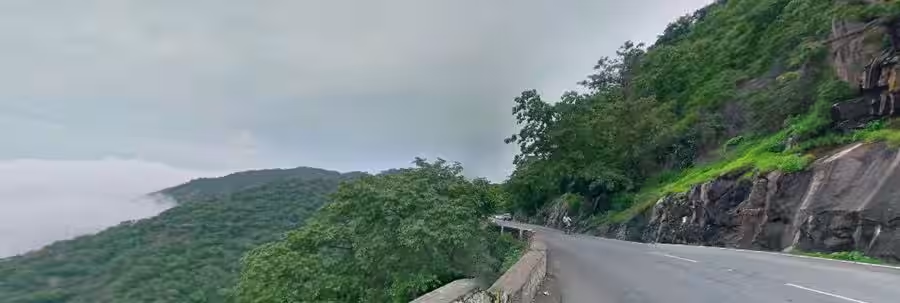 Winding mountain roads with sharp hairpin turns leading up to the hill station of Mount Abu, Rajasthan.